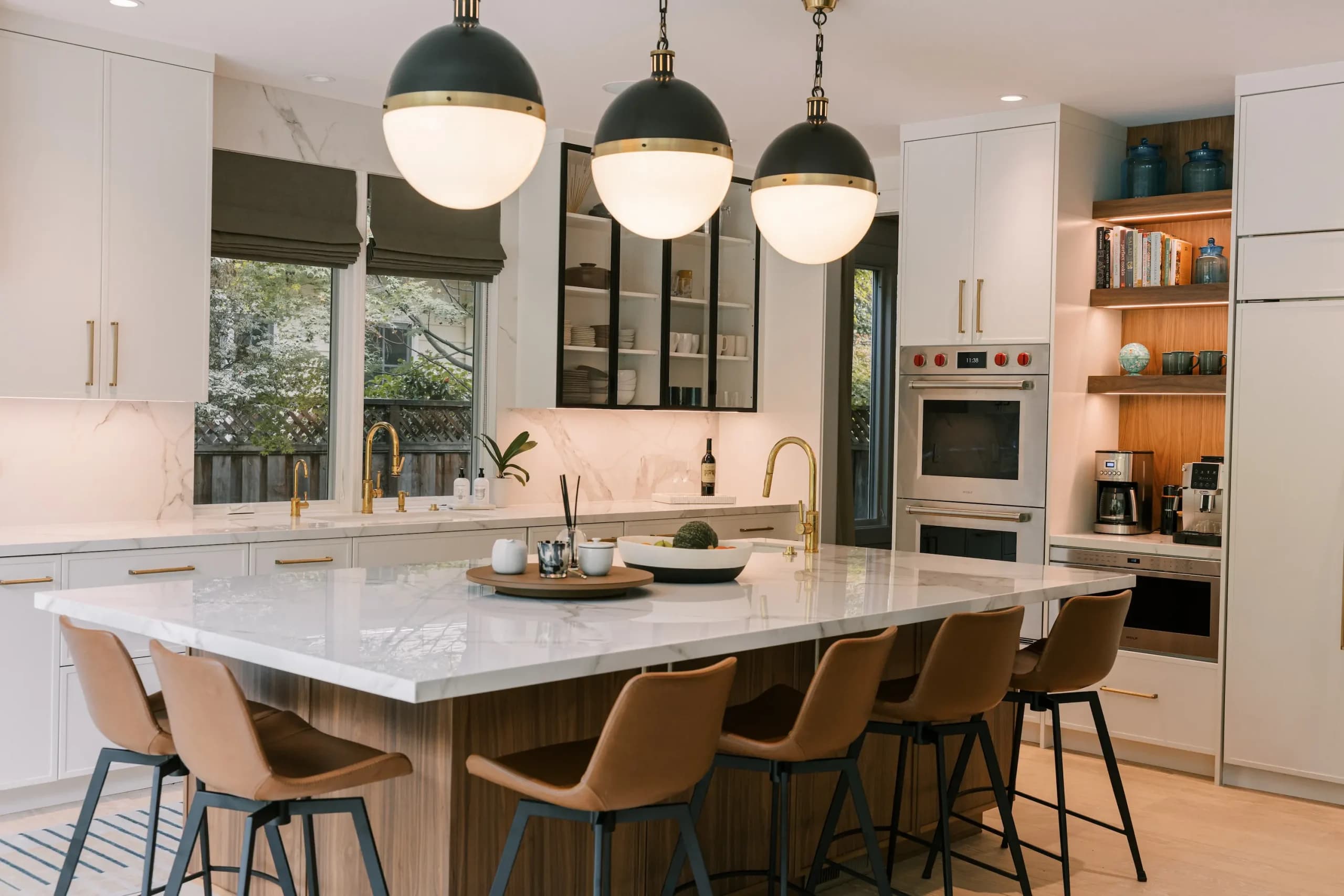 Transitional Crystal kitchen with custom cabinetry and dining area