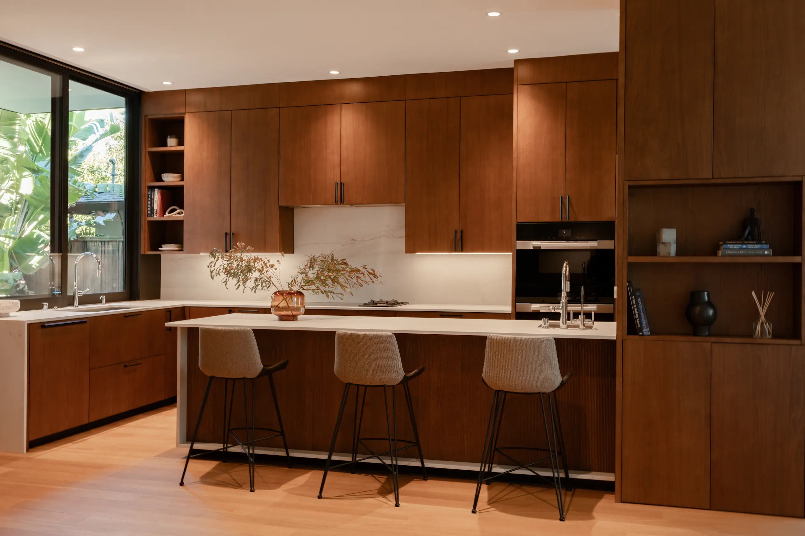 Contemporary DOCA kitchen with warm wood custom cabinetry